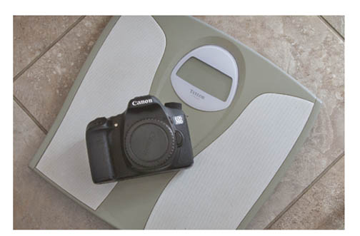 Photo of Canon EOS 70D on a bathroom scale