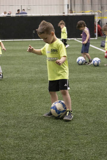 The only way to get a successful photo in this dimly lit environment was to use an ISO of 6400. Lens for indoor youth soccer