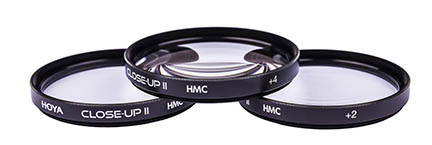Close-up filters for your RF-S 18-150mm lens often come is a set of 3 with varying levels of magnification. Screw-on close up filters
