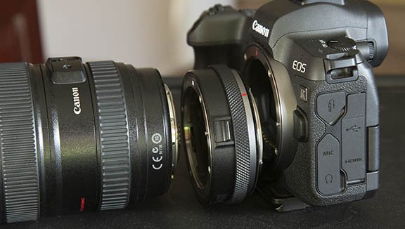 Lens, adapter, and camera