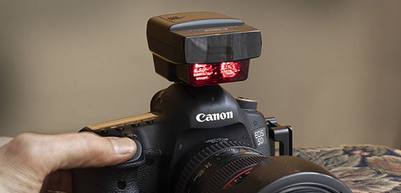 If you need to remotely trigger a Canon Speedlite, one solution is to use a Speedlite Transmitter ST-E2.  Simple controls, lightweight and has two channels
