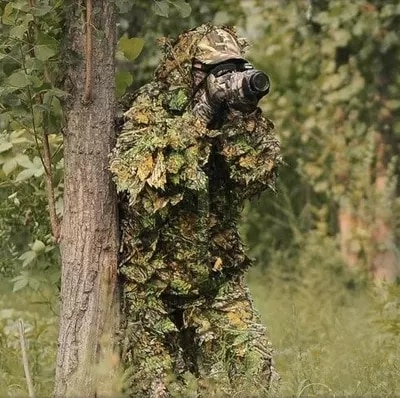 camouflaged photographer