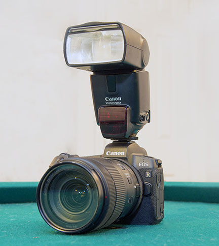 Canon R with Speedlite attached