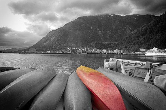 monochrome photo of kayaks